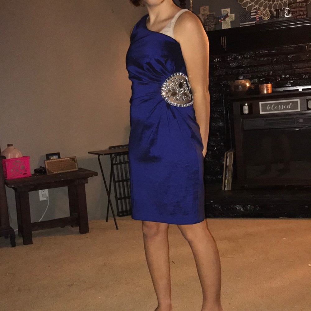 Satin blue exposed shoulder knee length dress.